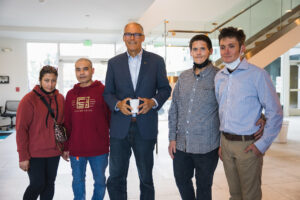 Governor Inslee and two couples who have been housed through Washington State Right of Way efforts.