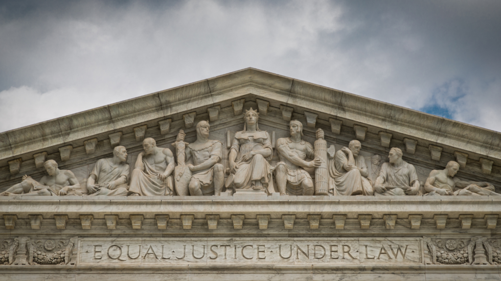 The roofline of United States Supreme Court building with the words "Equal Justice for All"