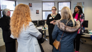 KCRHA CEO Dr. Kelly Kinnison speaks with community members and elected officials at our 2024 Open House event