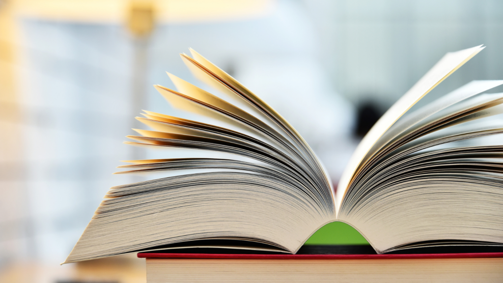 An image of an open reference book on a desk