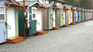 A row of tiny homes built by Sound Foundations NW at LIHI's Church by the Side of the Road Tiny Home Village in Tukwila, which will host families.